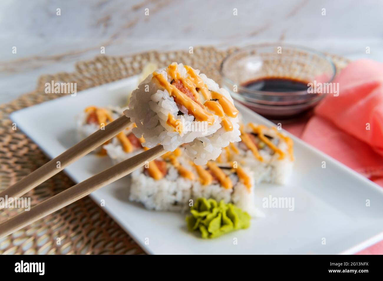Japanese salmon sushi with spicy sriracha kewpie mayonnaise Stock Photo