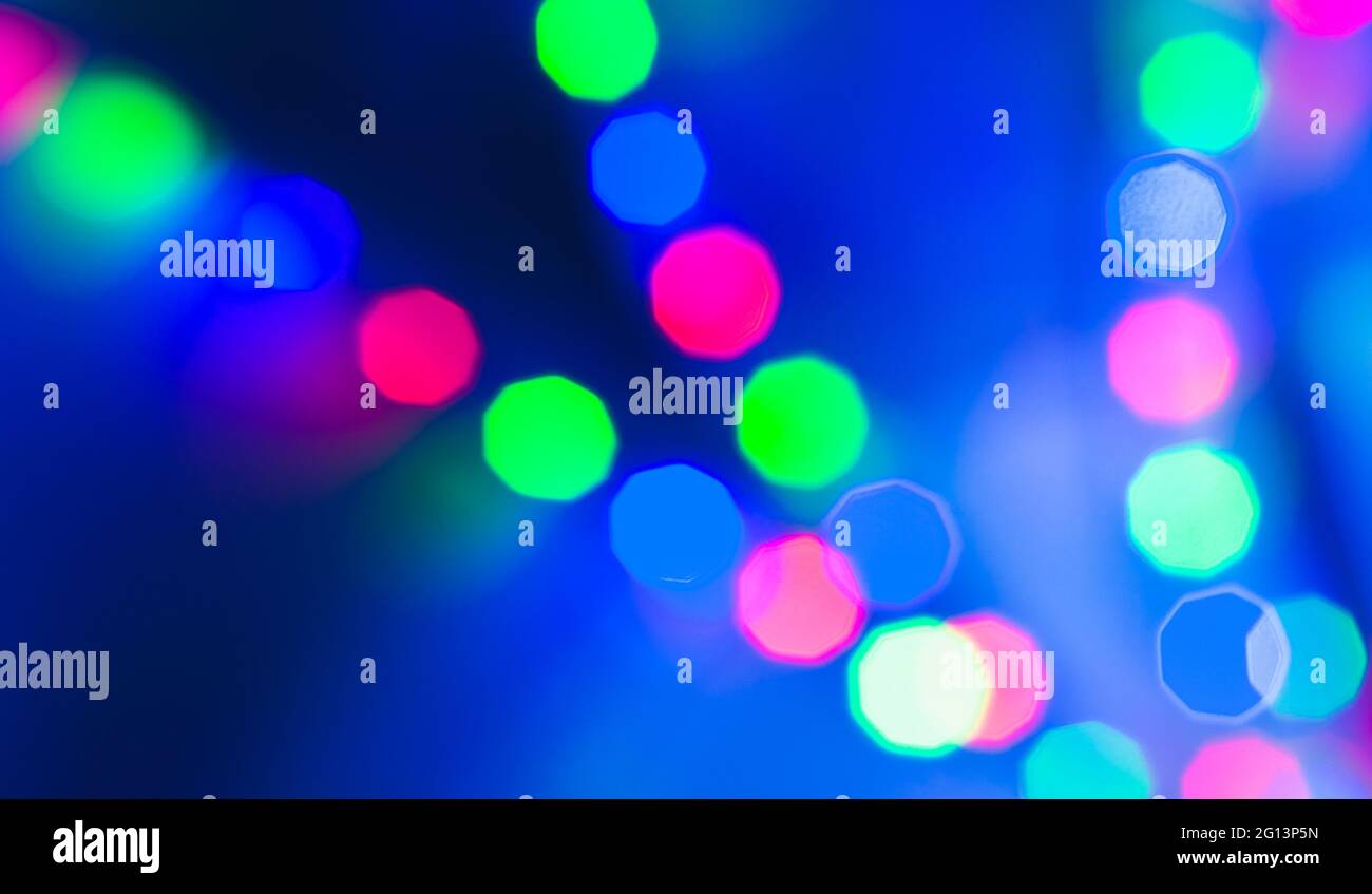Colorful lights bokeh over blue background. Abstract background photo Stock Photo