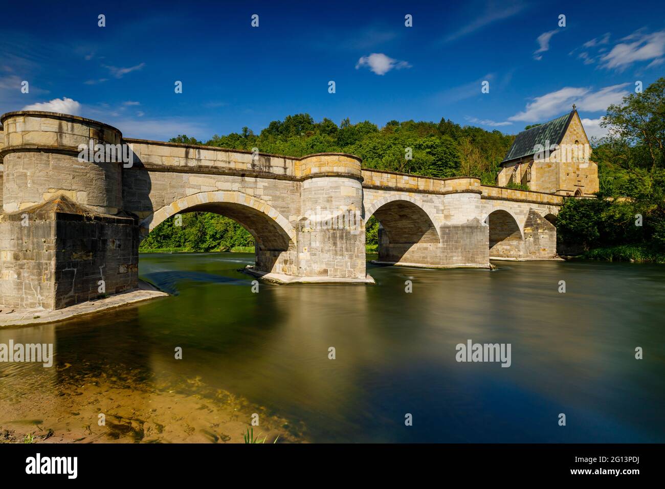 The historic bridge over the Werra River at Creuzburg in the Werra ...
