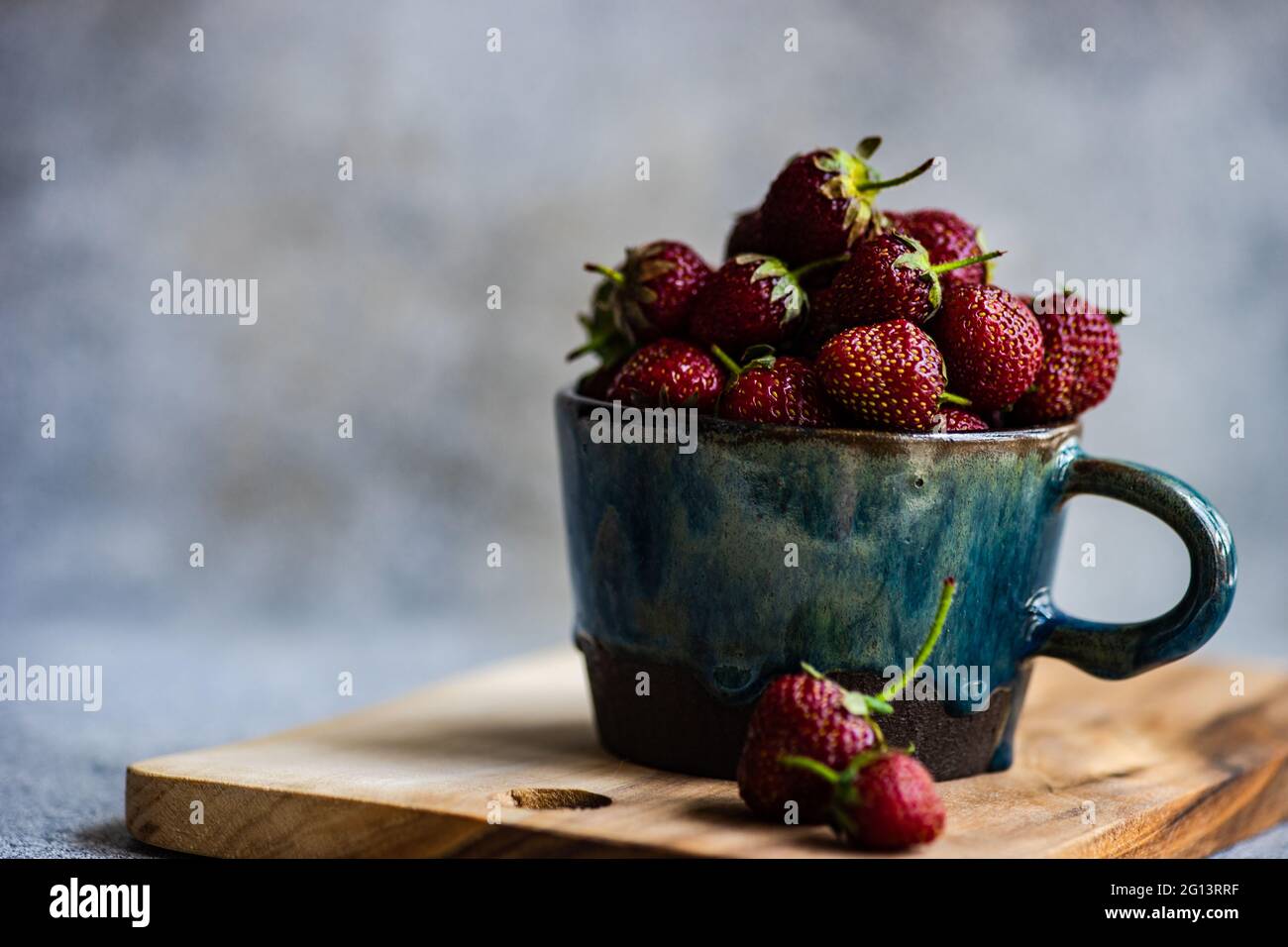 Summer background with ripe strawberries on concrete background Stock ...