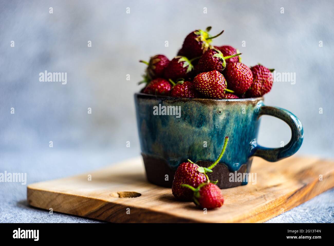 Summer background with ripe strawberries on concrete background Stock ...