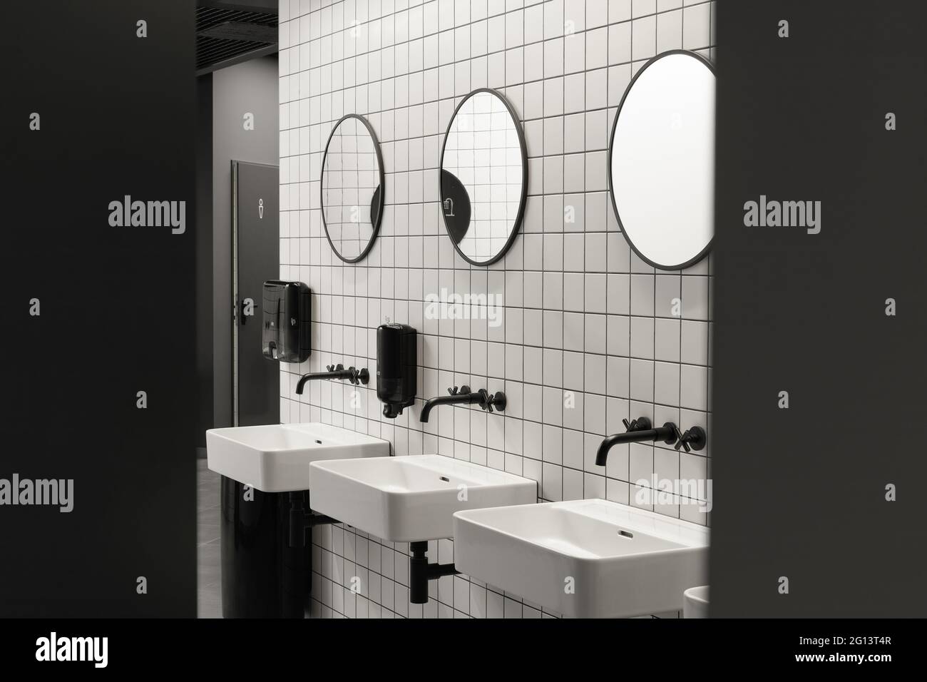 Modern public restroom minimal interior with metro style white tiles