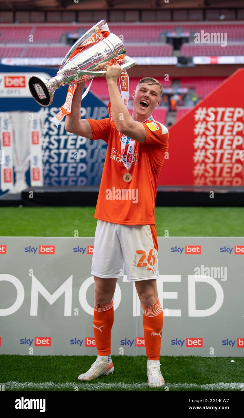 London, UK. 30th May, 2021. Blackpool Luke Garbutt with the trophy after the Sky Bet League 1 play-off final match between Blackpool and Lincoln City at Wembley Stadium, London, England on 29 May 2021. Photo by Andrew Aleksiejczuk/PRiME Media Images. Credit: PRiME Media Images/Alamy Live News Stock Photo