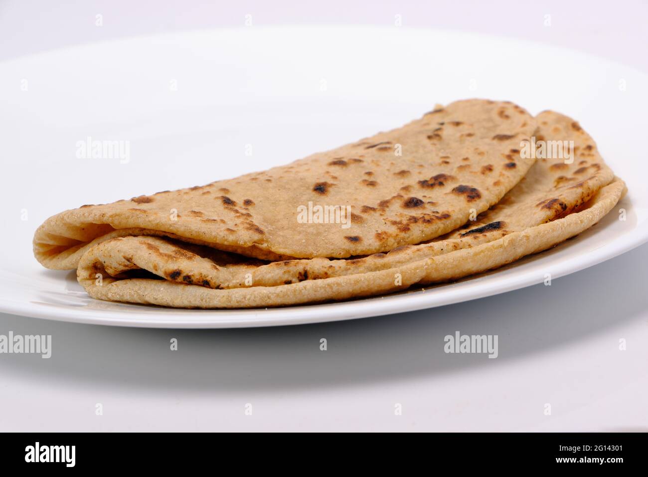 Indian style bread or roti served in a plate Stock Photo