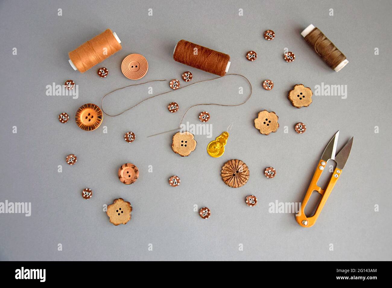 Sewing items: buttons, scissors, measuring tape on sewing pattern Stock  Photo - Alamy