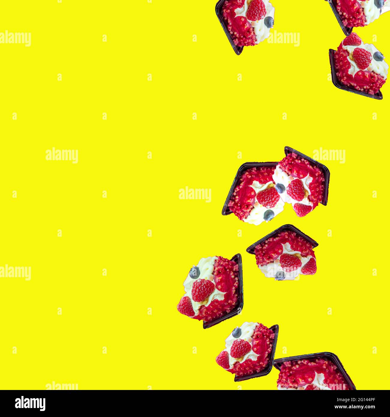 cakes fall from top to bottom on a yellow background on the right. flat flay Stock Photo