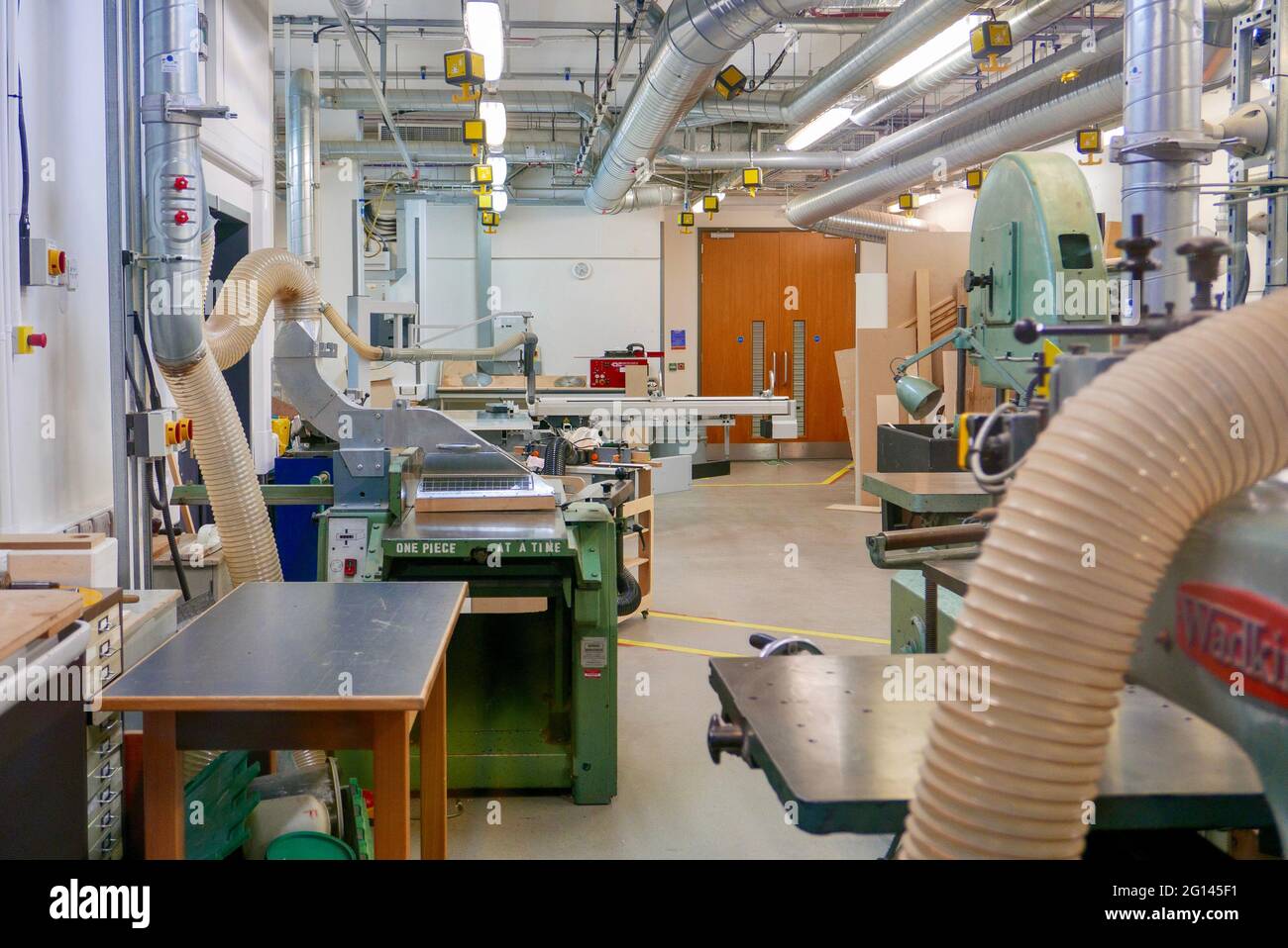 A woodwork and materials design technology workshop at Middlesex University, London, with workbenches and machinery. Stock Photo