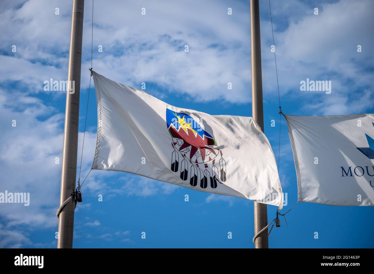Treat 7 Flag in Alberta at half mast, blue sky background Stock Photo Alamy