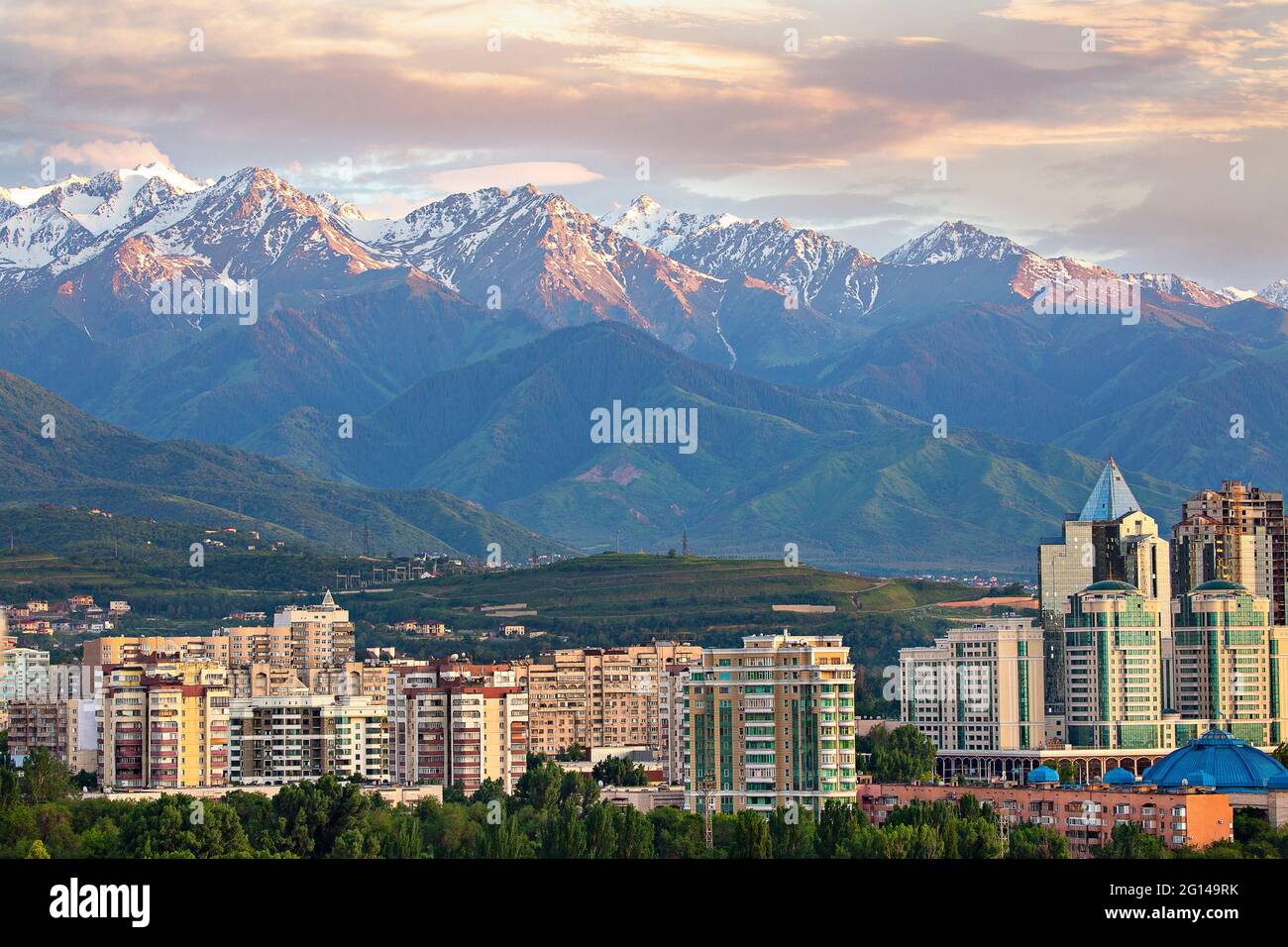 View over Almaty with snow capped mountains in the background, Almaty, Kazakhstan Stock Photo