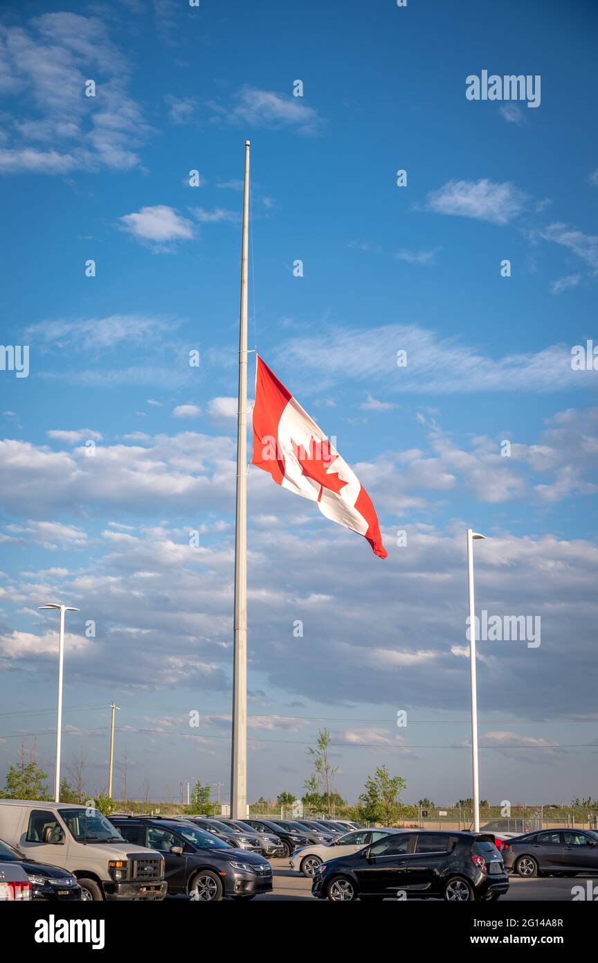 Canadian flag at half mast in Calgary, Alberta Stock Photo Alamy