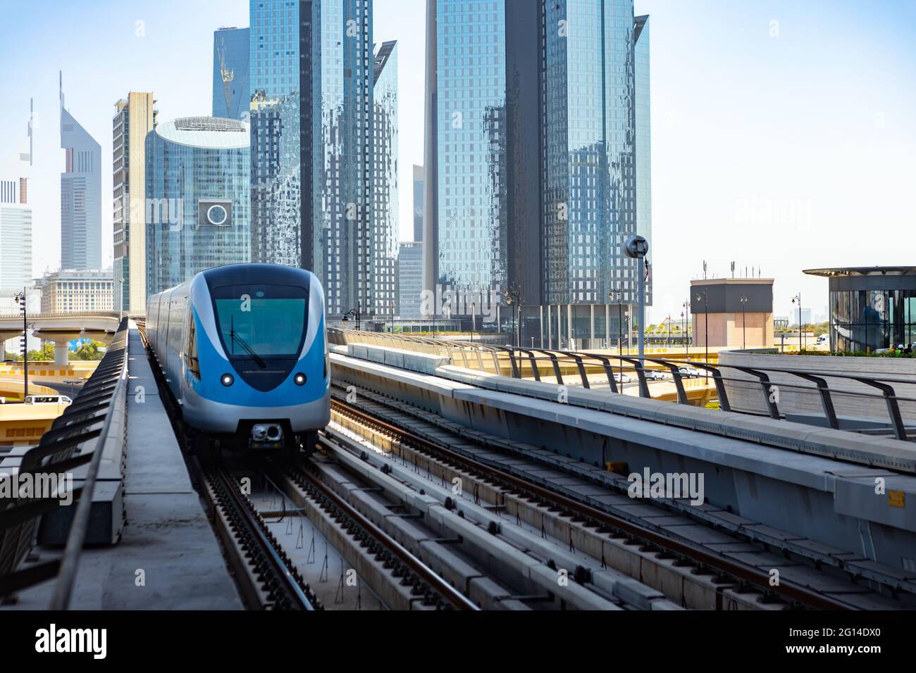 DUBAI, UAE - MARCH, 2020: Dubai Metro with skyscrapers at background ...