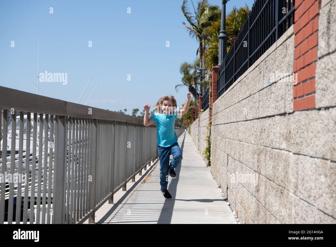 Break free. Energetic child run on promenade. Happy boy enjoy free time. Having fun. Summer vacation Stock Photo