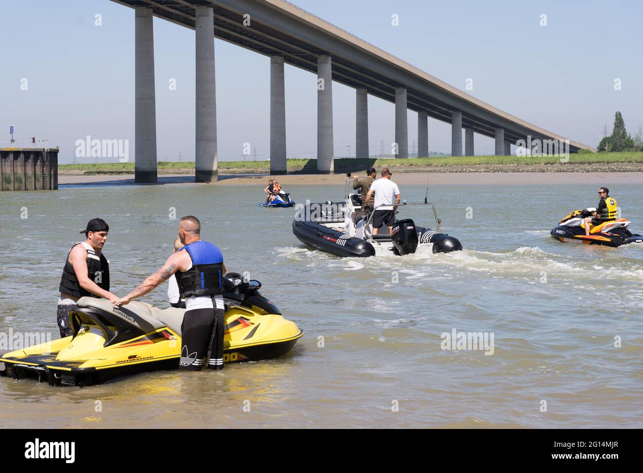 people , man and woman play water sport, jet ski boat at Isel of Sheppey, Sheerness island, Kent, England Stock Photo