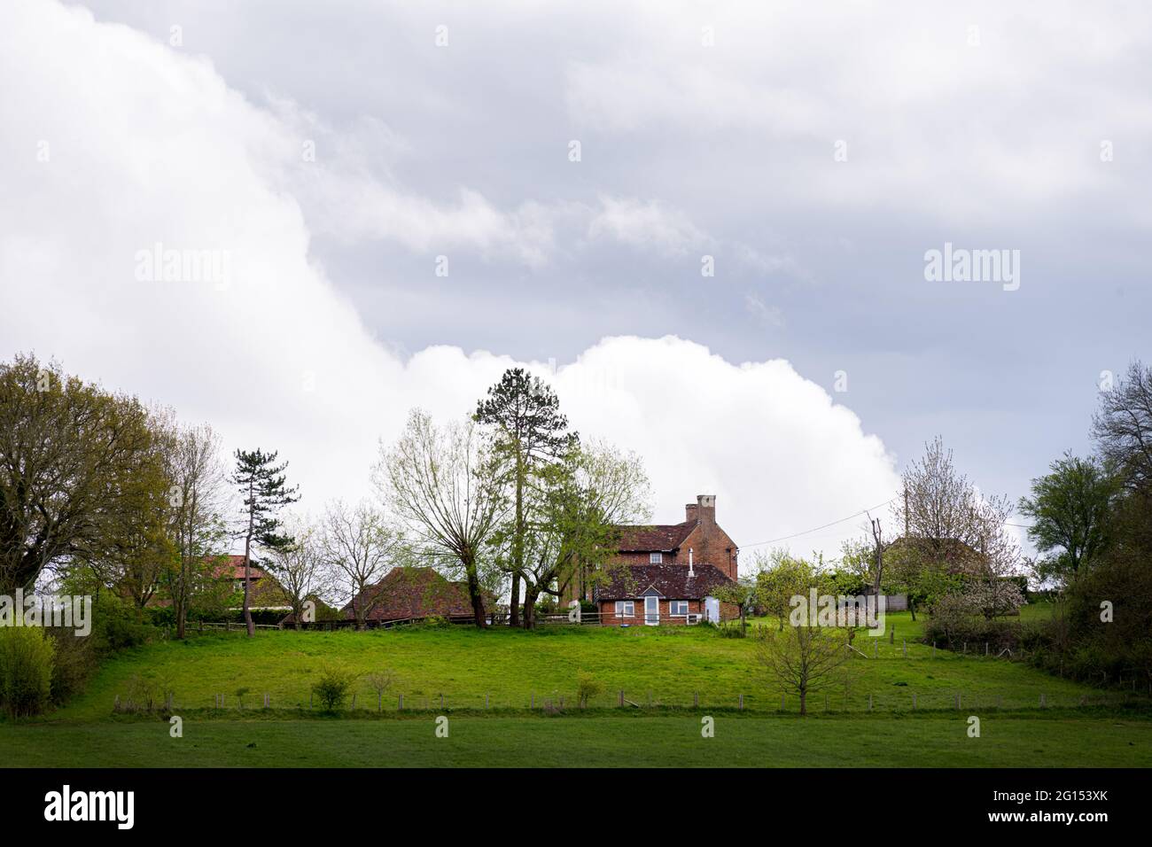 WEALDEN, ENGLAND MAY 9th, 2021 brick houses in the fields in spring