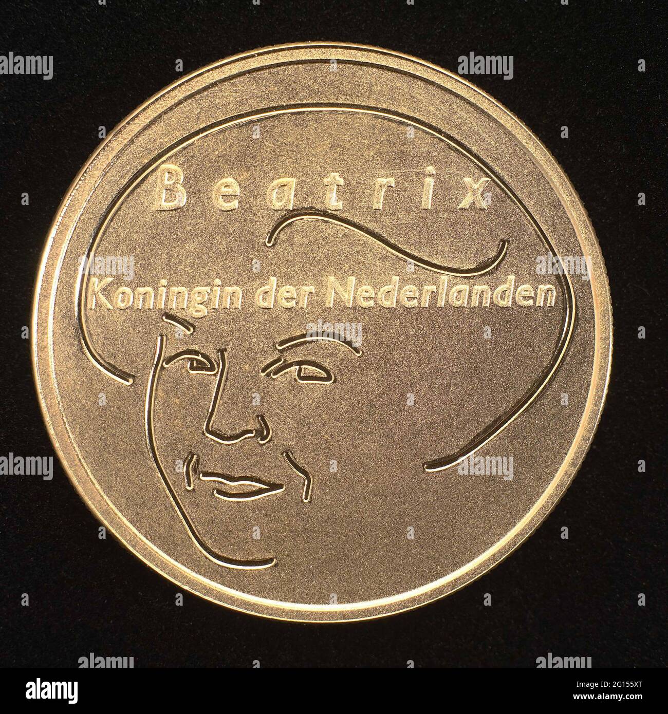 Golden Europamunt of 10 euros. Ten euro coins with on front in lines built  up portrait of Queen Beatrix with inscription and on the right mint value  and in circumcision. The name