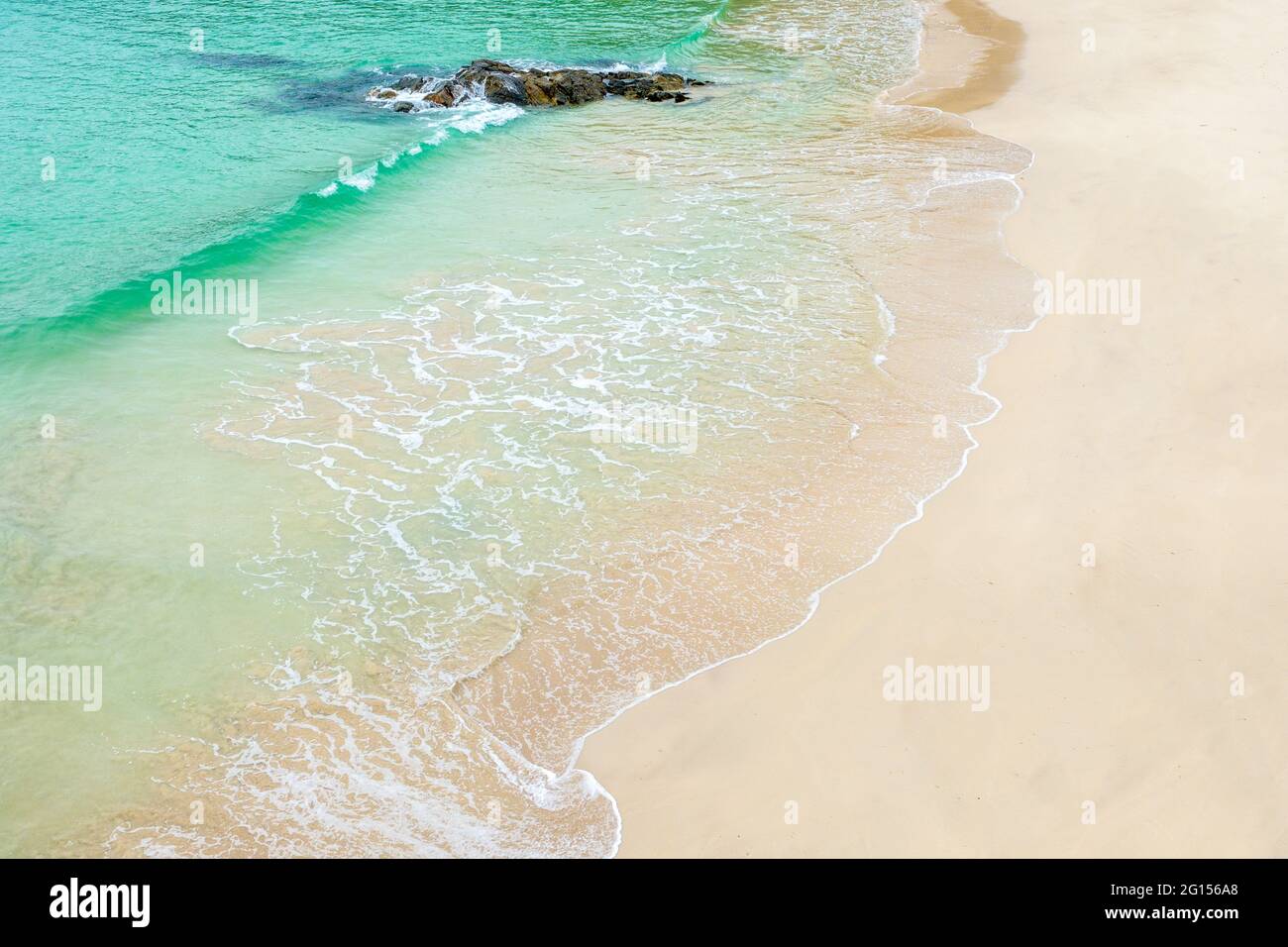 Clear water lapping the white sand of a Scottish beach Stock Photo