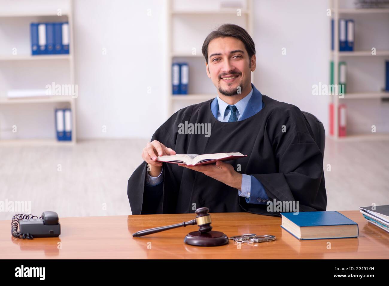 Judge Example Young judge working in the courtroom Stock Photo - Alamy