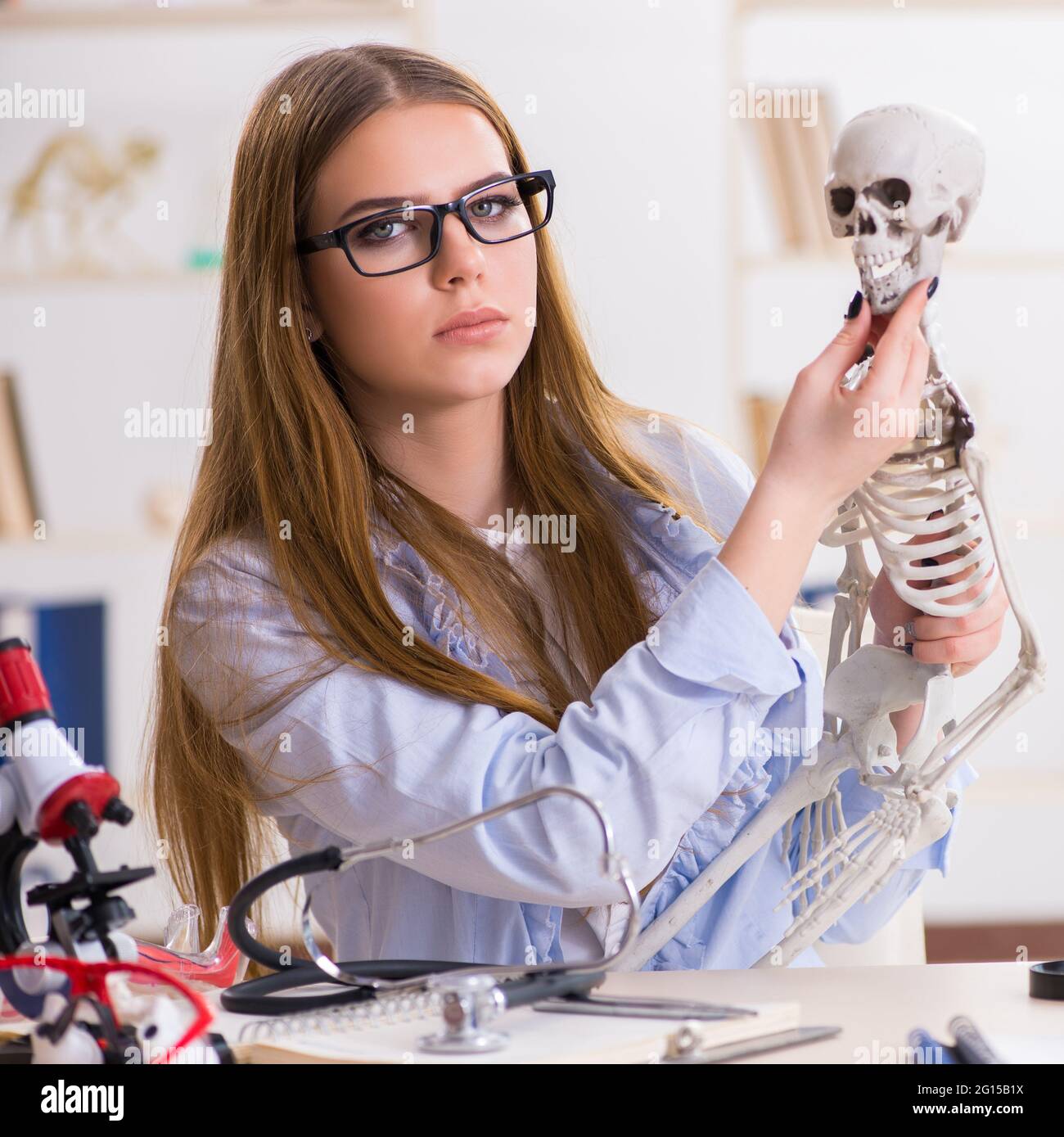 The student sitting in classroom and studying skeleton Stock Photo - Alamy