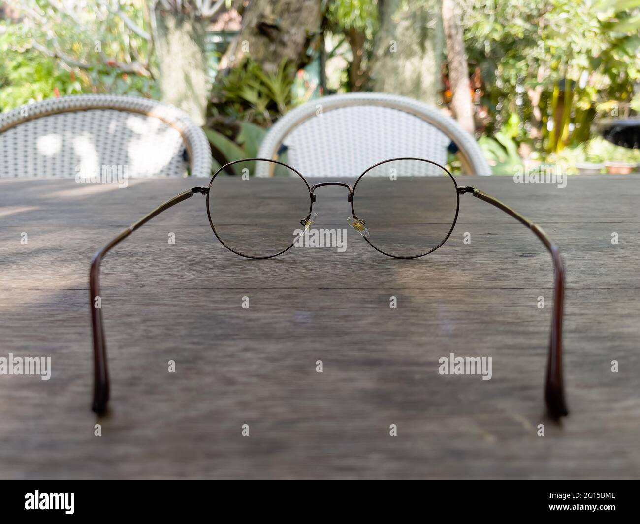 Eyeglasses on old wooden table, stock photo Stock Photo