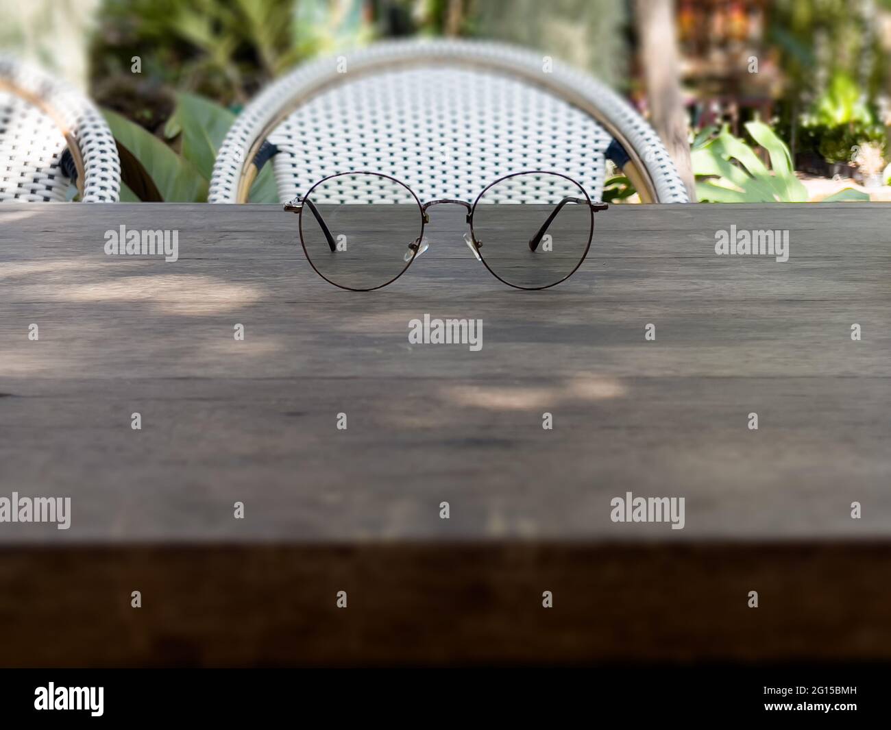 Eyeglasses on old wooden table, stock photo Stock Photo