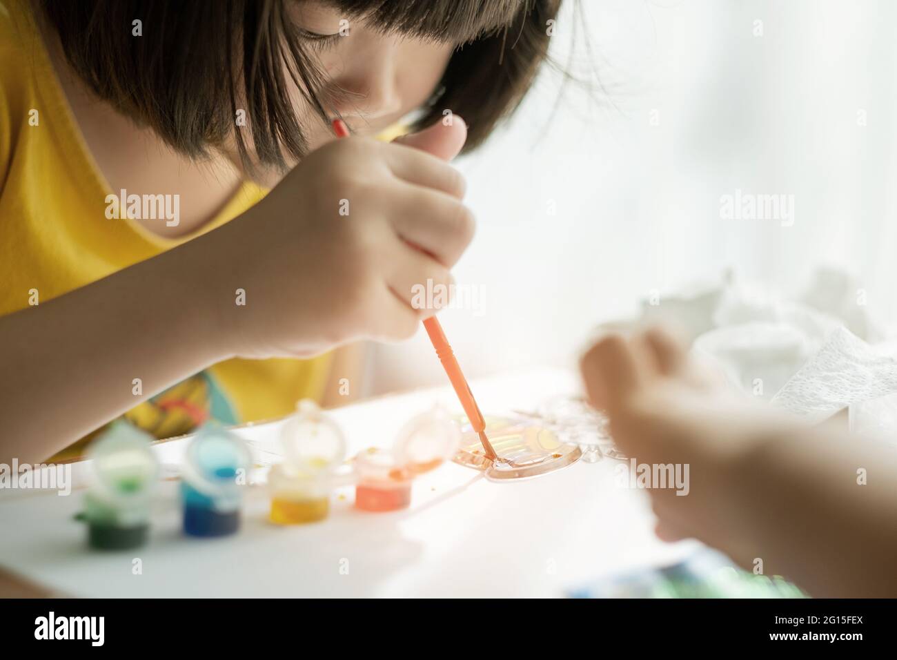 kid is painting color, education concept Stock Photo - Alamy