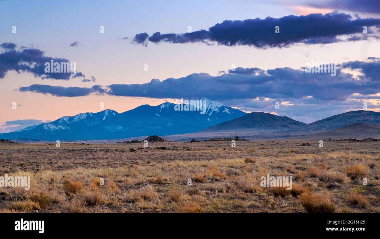 Clouds at sunset over the San Francisco Peaks and SP Crater, north of Flagstaff, Arizona, USA Stock Photo