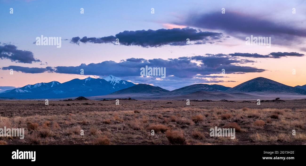 Clouds at sunset over the San Francisco Peaks and SP Crater, north of Flagstaff, Arizona, USA Stock Photo