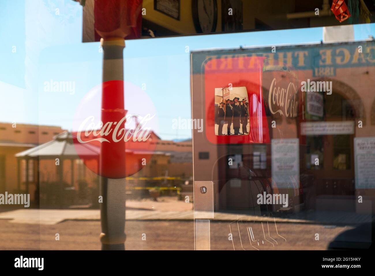 Coca Cola sign and scene from the movie 'Tombstone' reflected outside the Bird Cage Theatre in Tombstone, Arizona, USA Stock Photo
