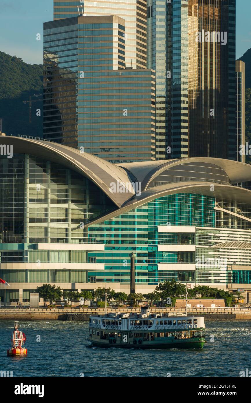 An iconic Star Ferry crosses Victoria Harbour in front of the