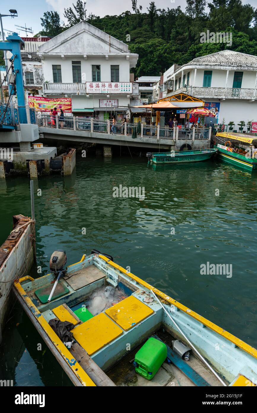 Boats and tourists at the village of Tai O, Lantau Island, Hong Kong Stock Photo