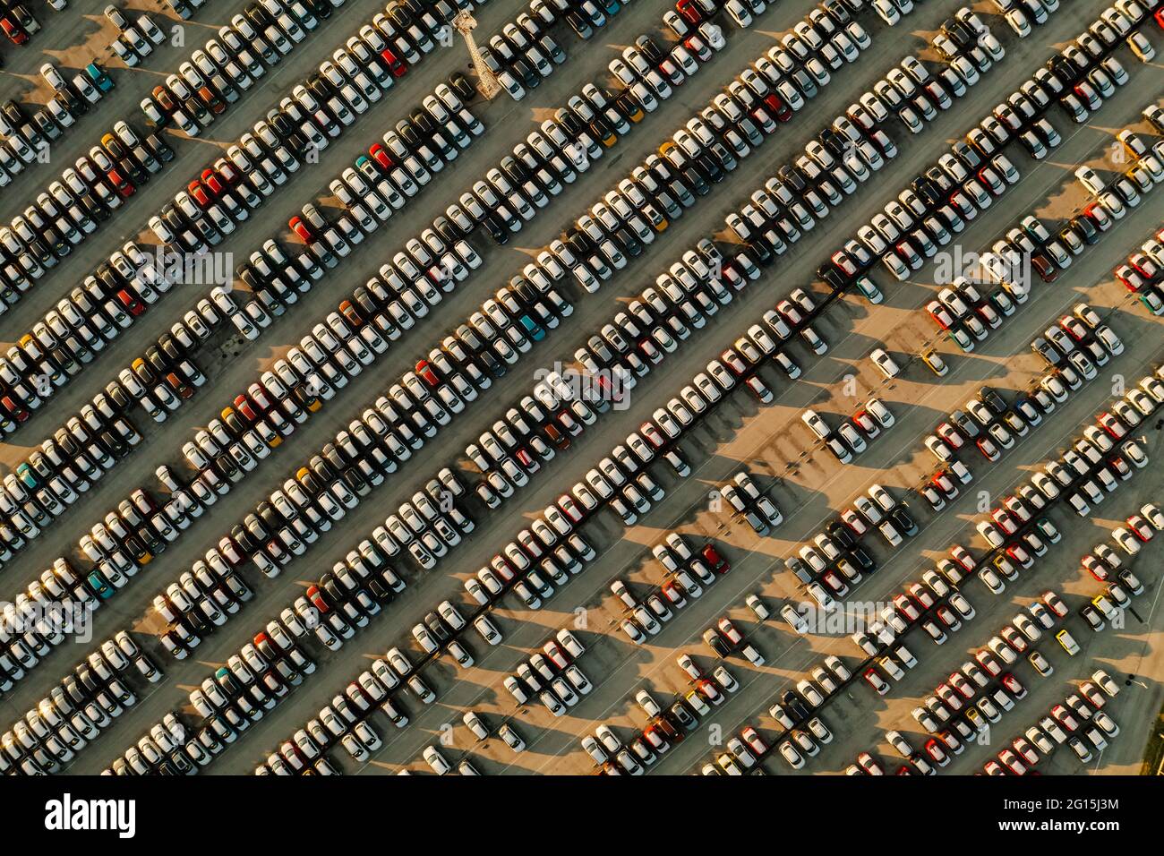 Aerial view new cars lined up in the parking station for import and export business logistic to dealership for sale, Automobile and automotive car par Stock Photo