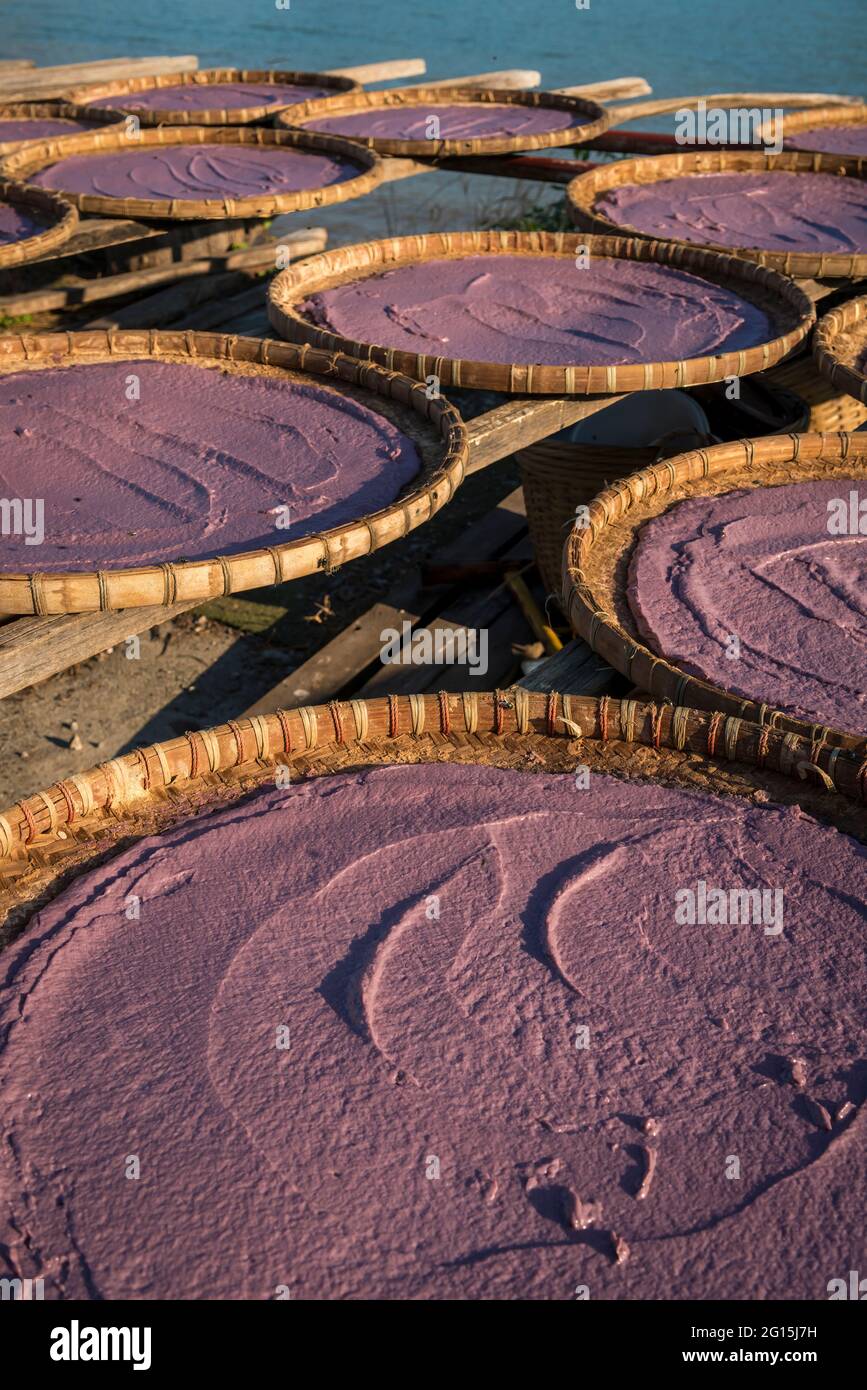 Shrimp paste drying in rattan trays, Tao O, Lantau Island, Hong Kong Stock Photo