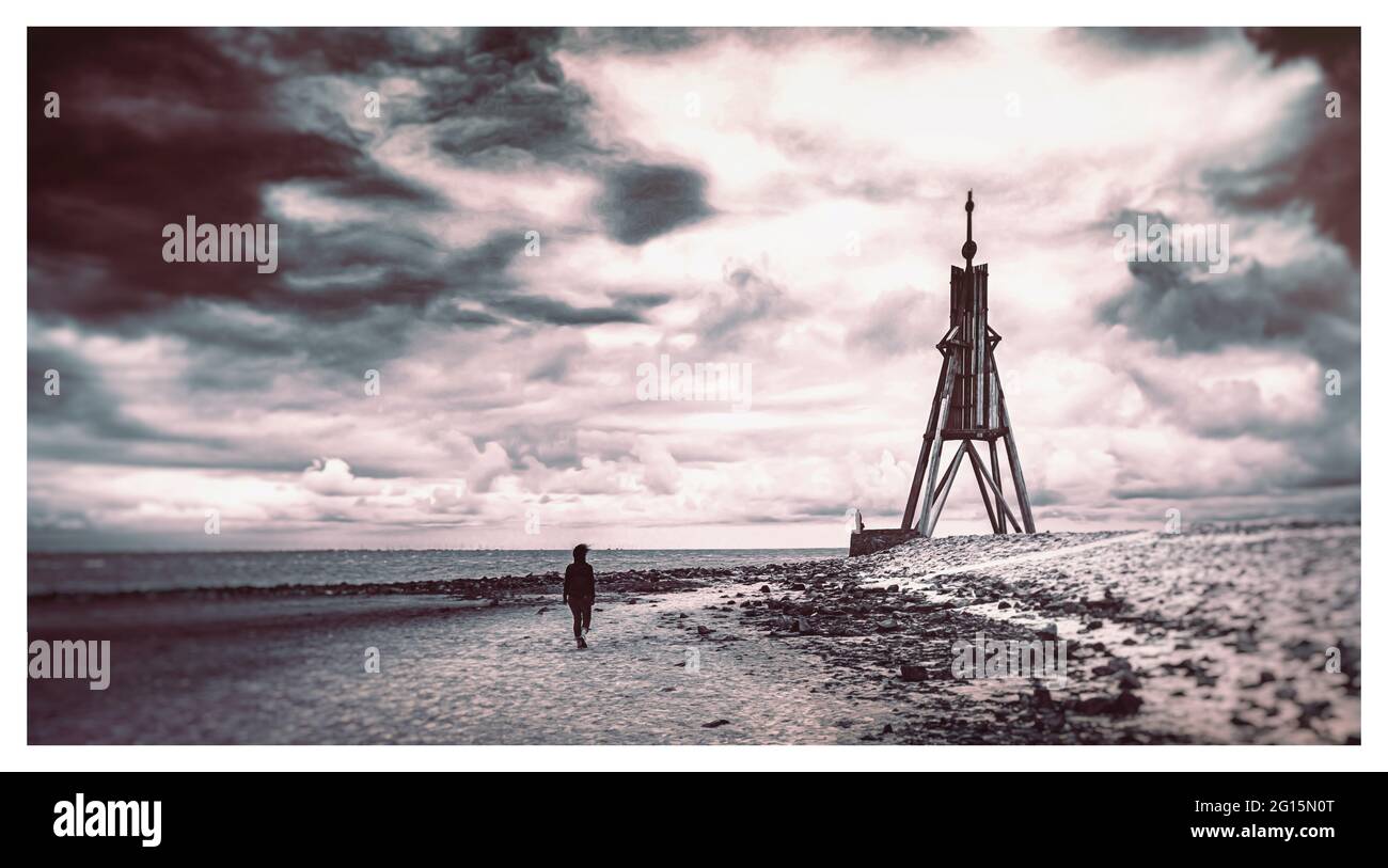 Cuxhaven on the German North Sea coast. The Kugelbake, a wooden beacon, stands at the mouth of the Elbe. Wadden Sea World Heritage Stock Photo