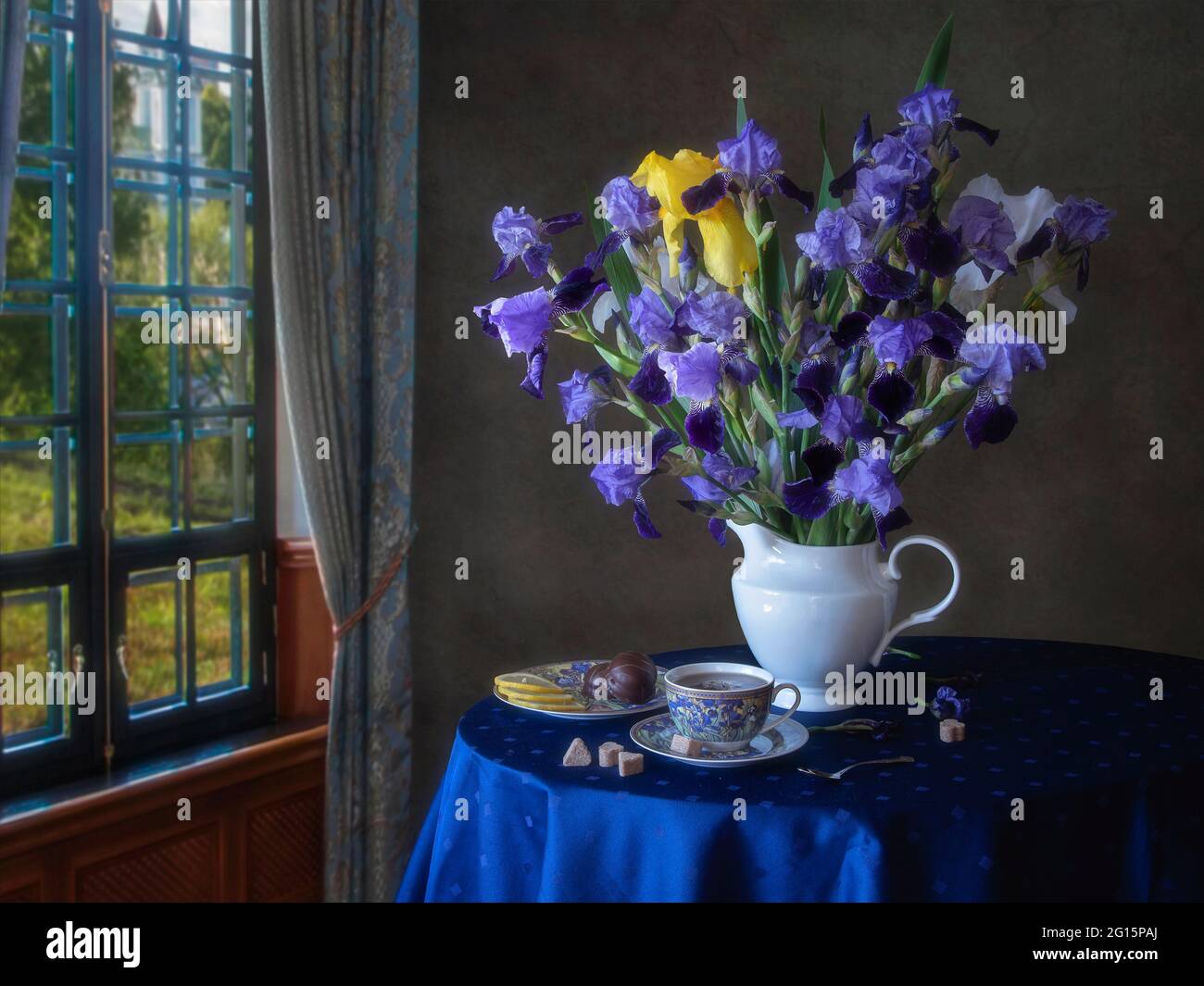 Still life with bouquet of flowers on a tea table Stock Photo - Alamy