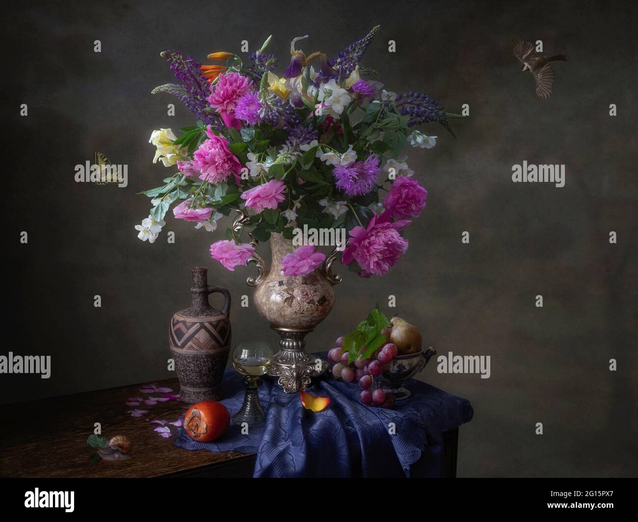 Still life with beautiful bouquet of flowers and fruits Stock Photo - Alamy
