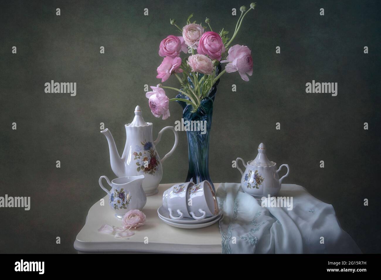 Still life with bouquet of pink buttercups Stock Photo - Alamy