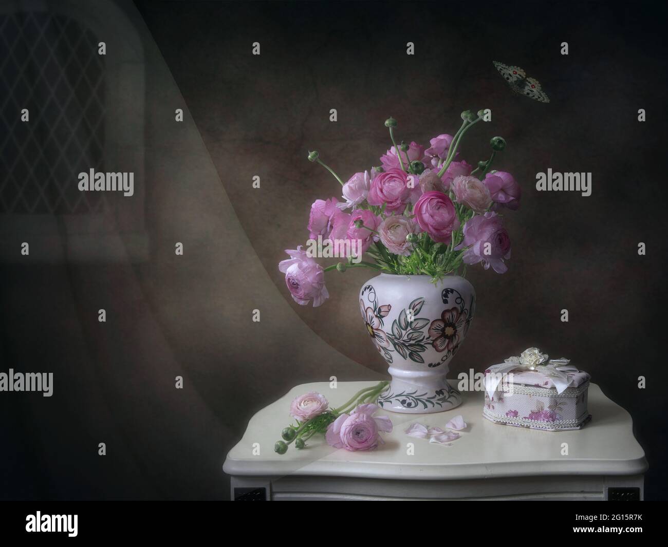 Still life with bouquet of pink buttercups Stock Photo - Alamy
