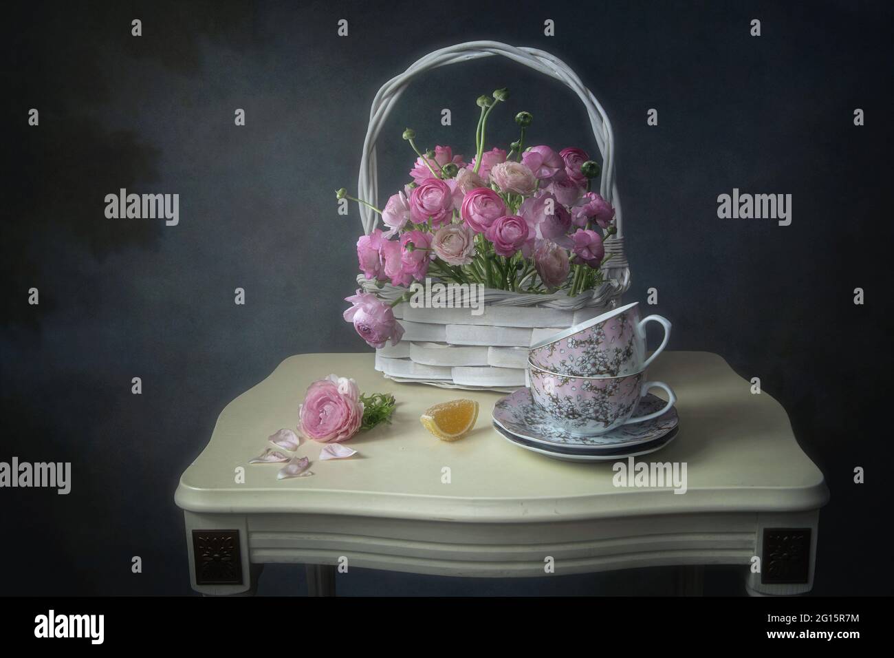 Still life with bouquet of pink buttercups Stock Photo - Alamy