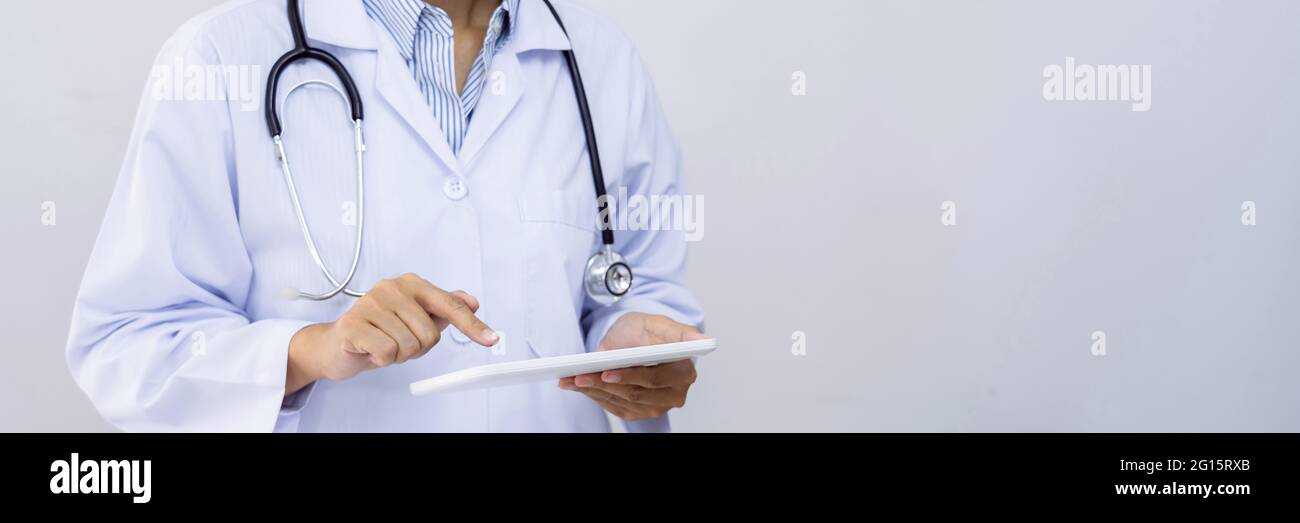 A male doctor undertaking patient consultations and physical examinations at the specialized hospital. Stock Photo