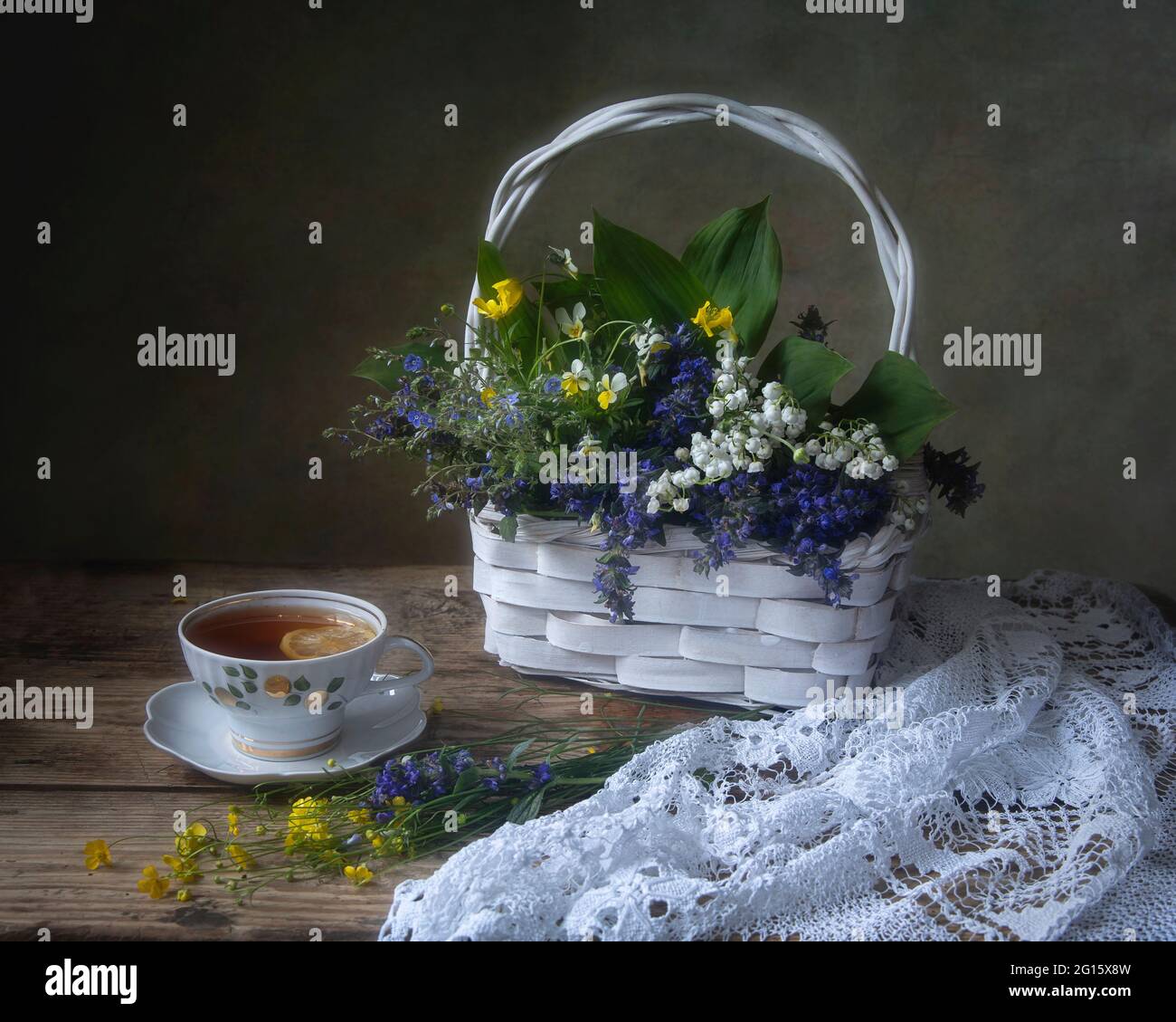Still life with beautiful bouquet of flowers on a tea table Stock Photo