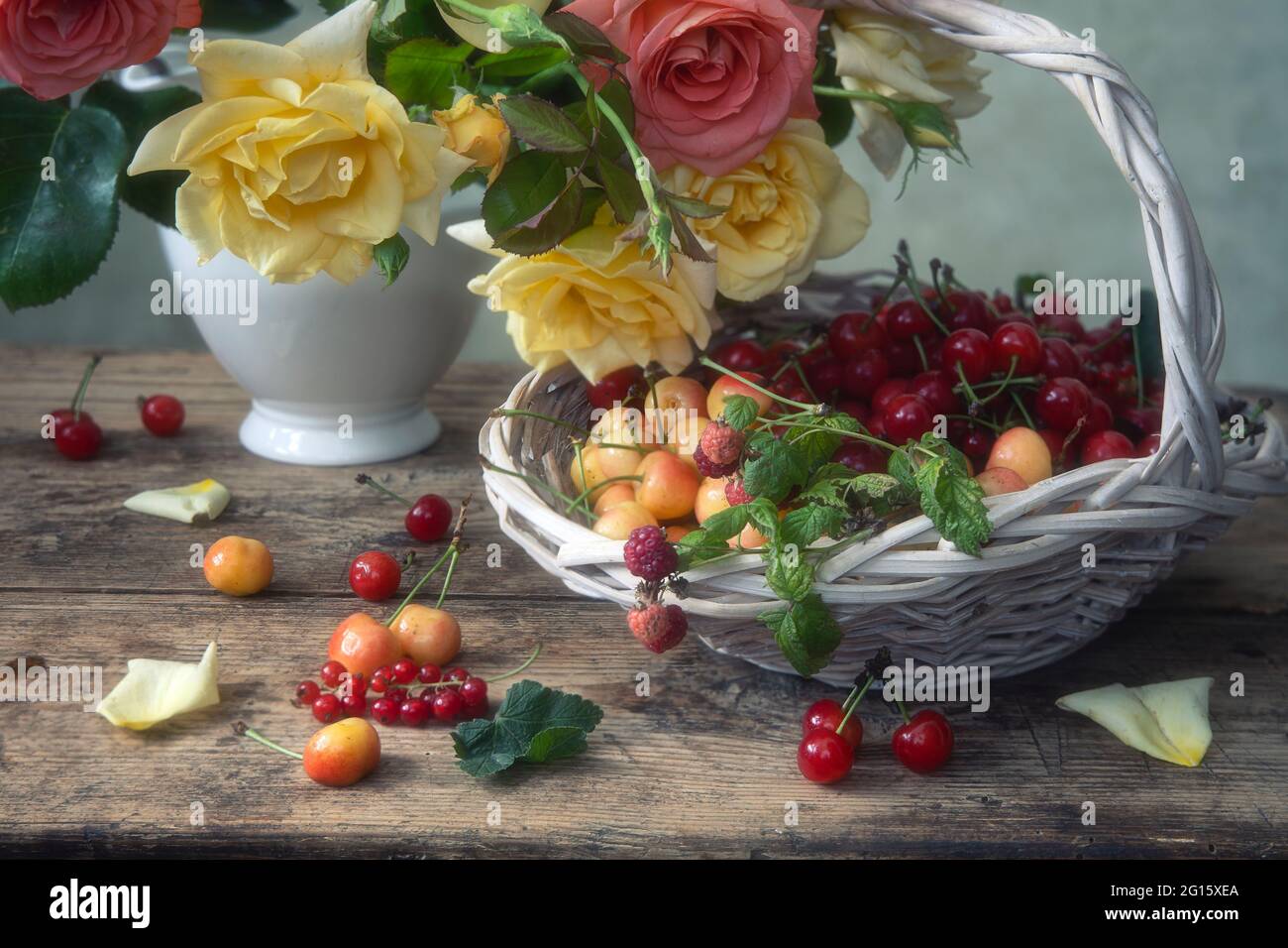 Still life with beautiful bouquet of flowers and fruits Stock Photo - Alamy