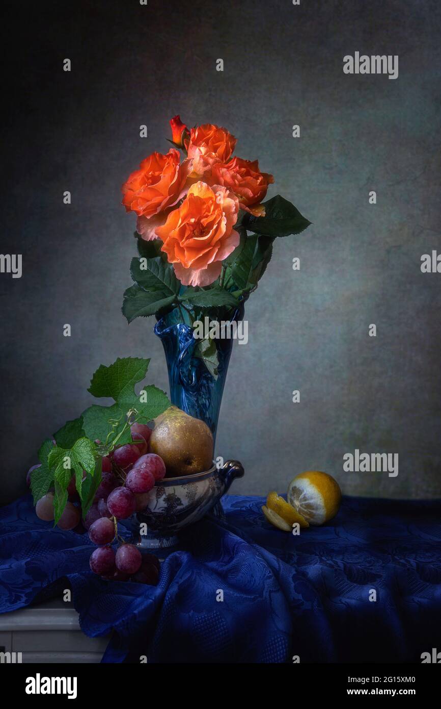 Still life with beautiful bouquet of flowers and fruits Stock Photo - Alamy