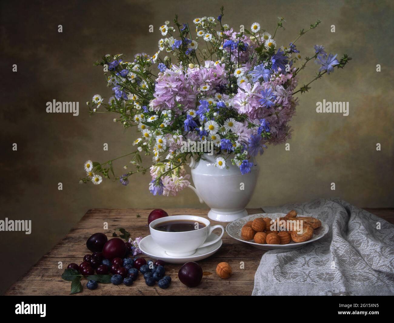 Still life with beautiful bouquet of flowers on a tea table Stock Photo ...