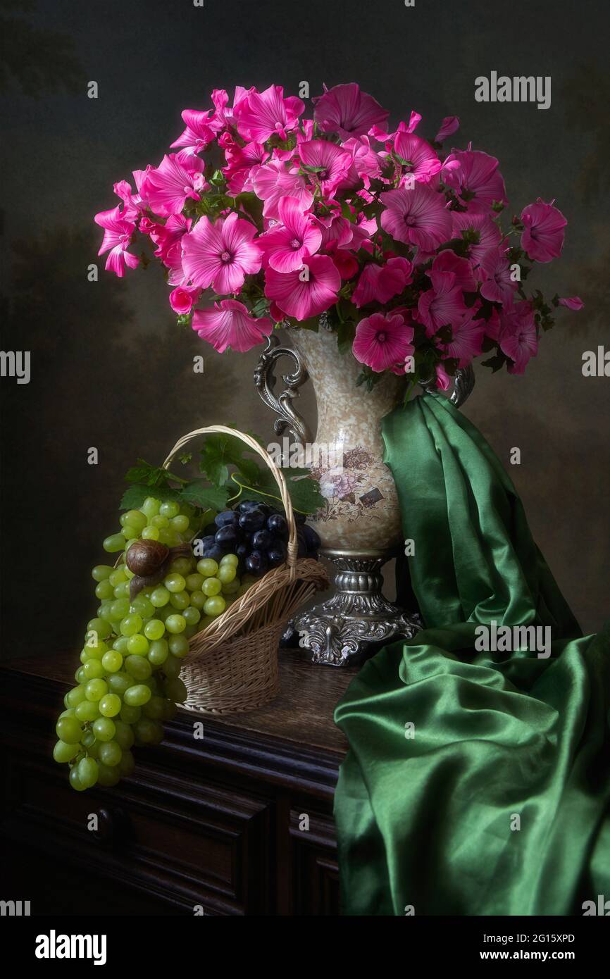 Still life with beautiful bouquet of flowers and fruits Stock Photo - Alamy