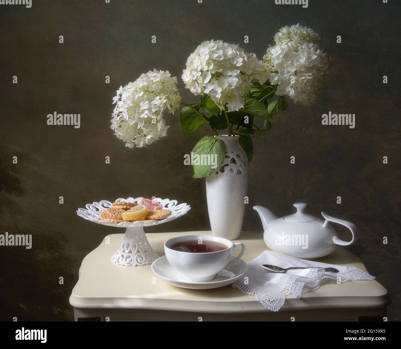 Still life with beautiful bouquet of flowers on a tea table Stock Photo ...