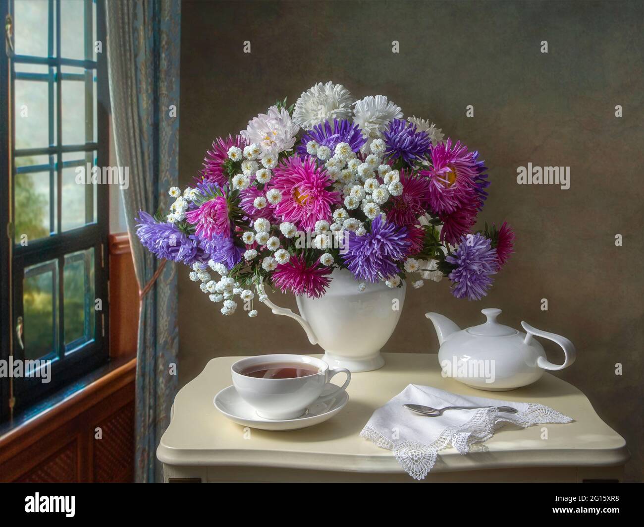 Still life with beautiful bouquet of flowers on a tea table Stock Photo ...