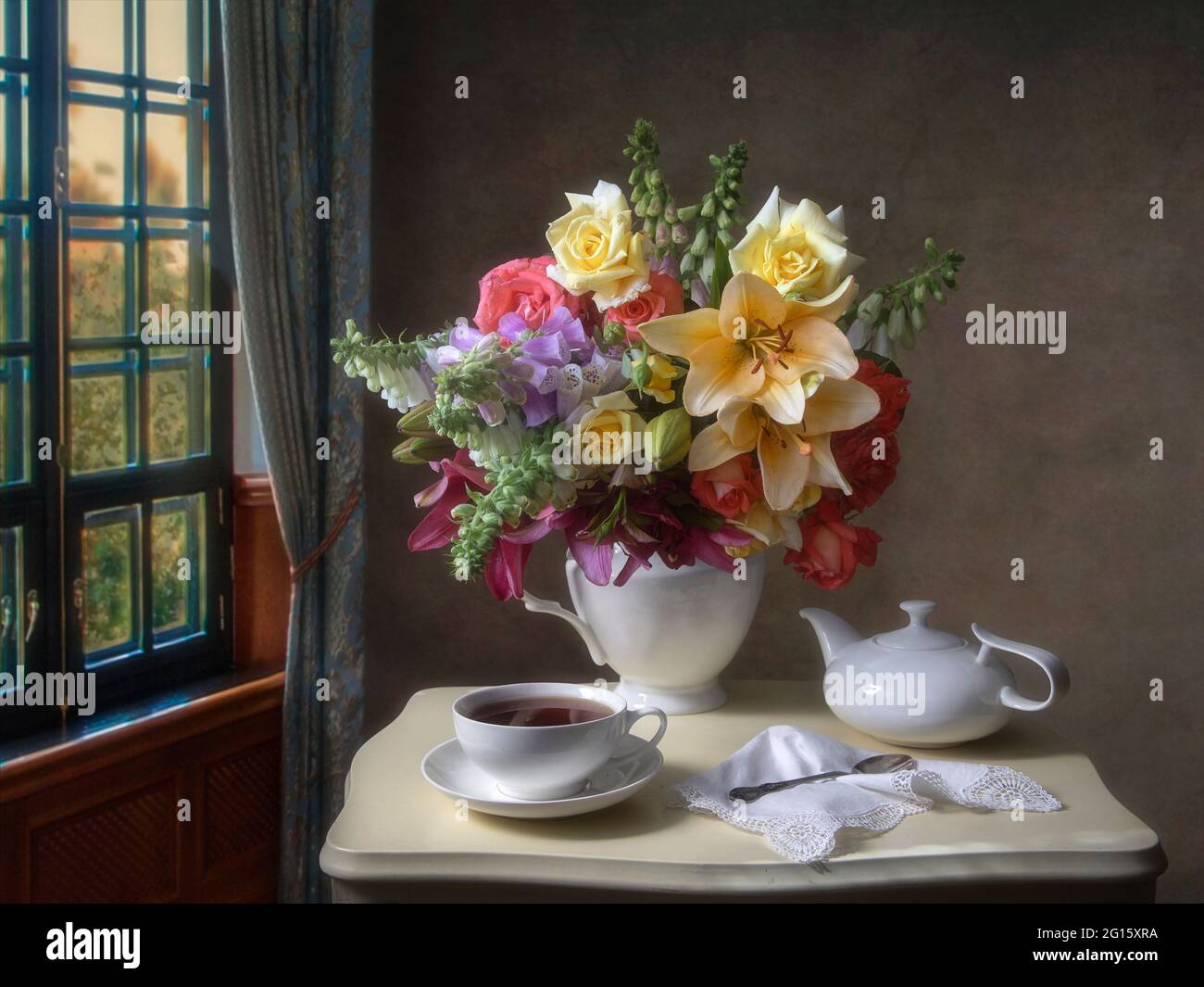 Still life with beautiful bouquet of flowers on a tea table Stock Photo ...