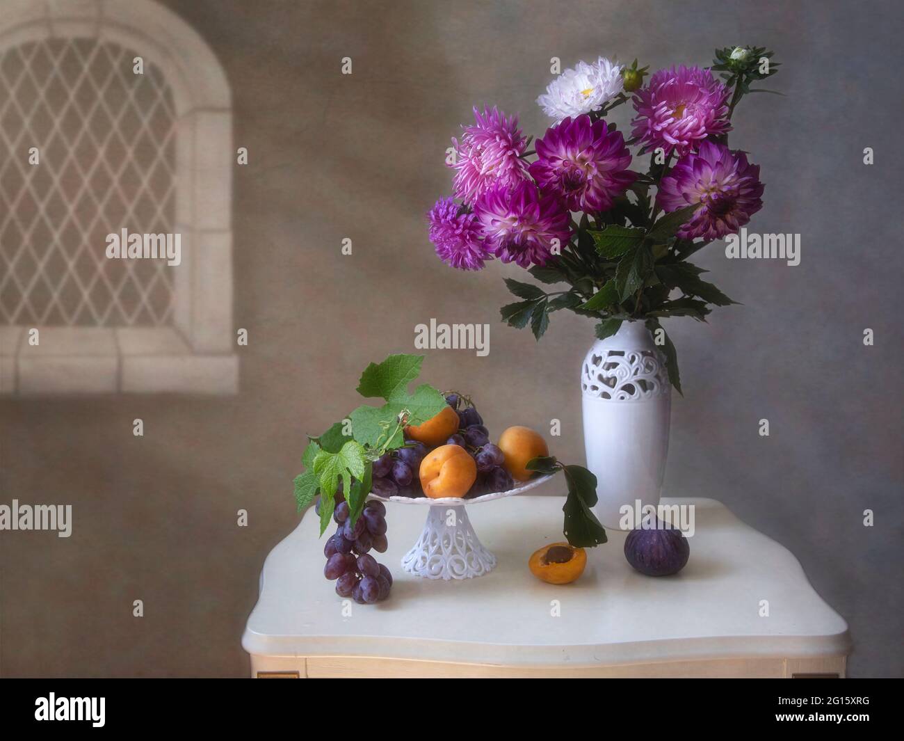 Still life with beautiful bouquet of flowers and fruits Stock Photo - Alamy