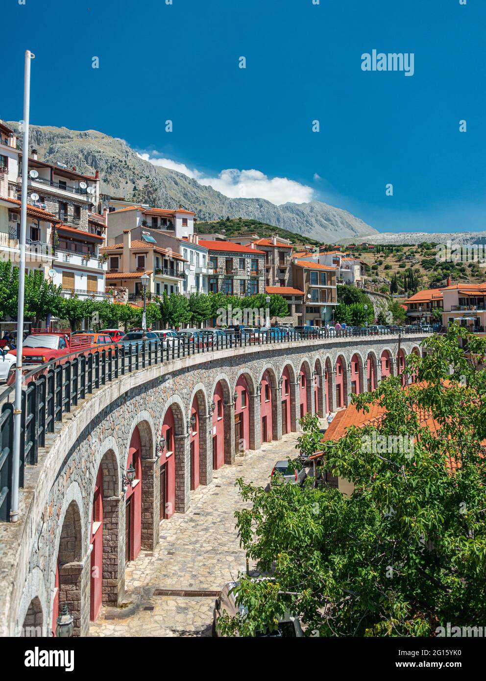 Cobbled alley and stone houses in the mountain town of Arachova at the foot of Mount Parnassos in Viotia, Greece Stock Photo