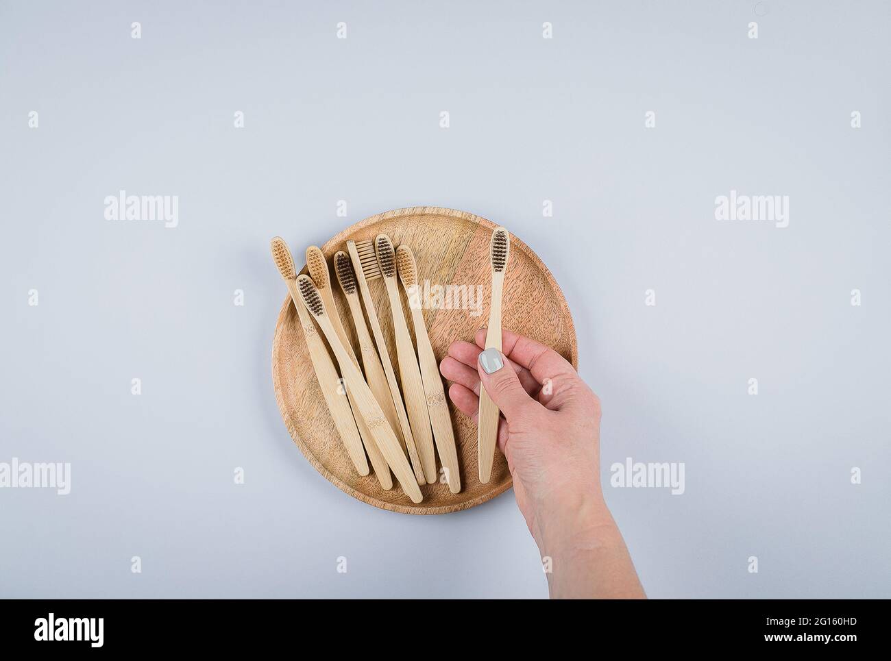 Flat lay with bamboo toothbrushes, empty notepad blank. Eco natural ...